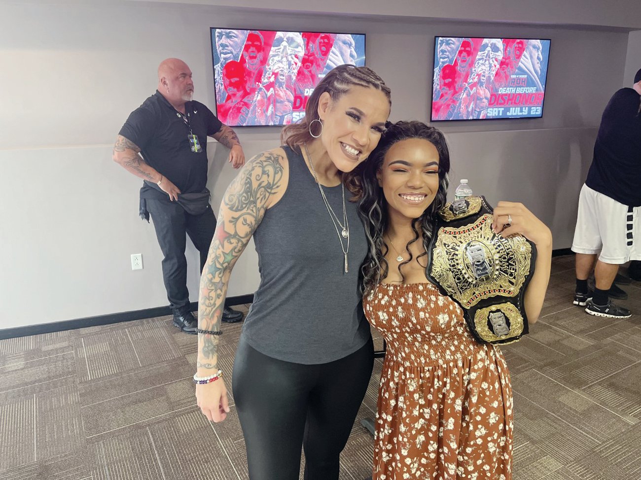 CHAMPION: Jaychele Nicole Schenck gets a hug from ROH Women’s World Champion, Mercedes Martinez.
